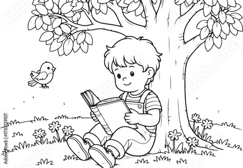 Young boy reading a book under a large tree
