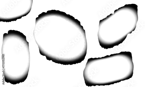 A set of realistic burnt paper holes with scorched and charred edges. A collection of grunge frames for vintage maps or Halloween designs. Fire burn mark elements isolated on a transparent background.