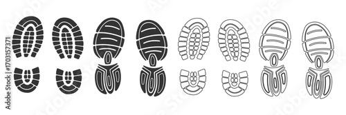 Collection of Black Footprints and Shoe Prints on White Background