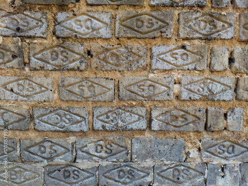 Close up textured brick wall, industrial background of traditional construction material for architecture, urban design, and rustic pattern concept.