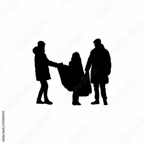 Silhouette of volunteers distributing blankets to people in winter