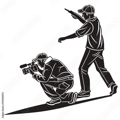 Photographer and cameraman working together.