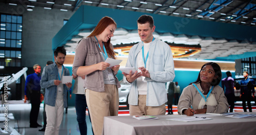 Bild auf Leinwand Engaging Audience At Trade Show: Saleswoman Presents Diverse