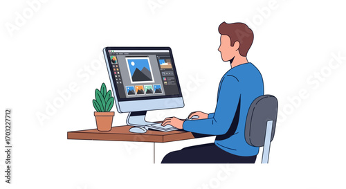 Man focused on photo editing software.