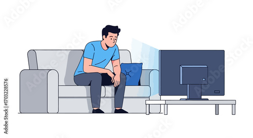Man watching television sitting on the sofa at home.