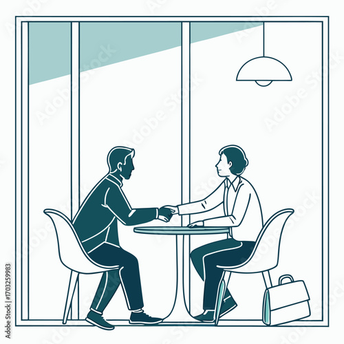 Two business professionals shaking hands across a table.