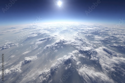 High-angle view of a planet's cloud cover.  Vast expanse of white, fluffy clouds stretching across the frame.  Bright sun visible above the clouds.  A deep blue atmosphere surrounds the scene