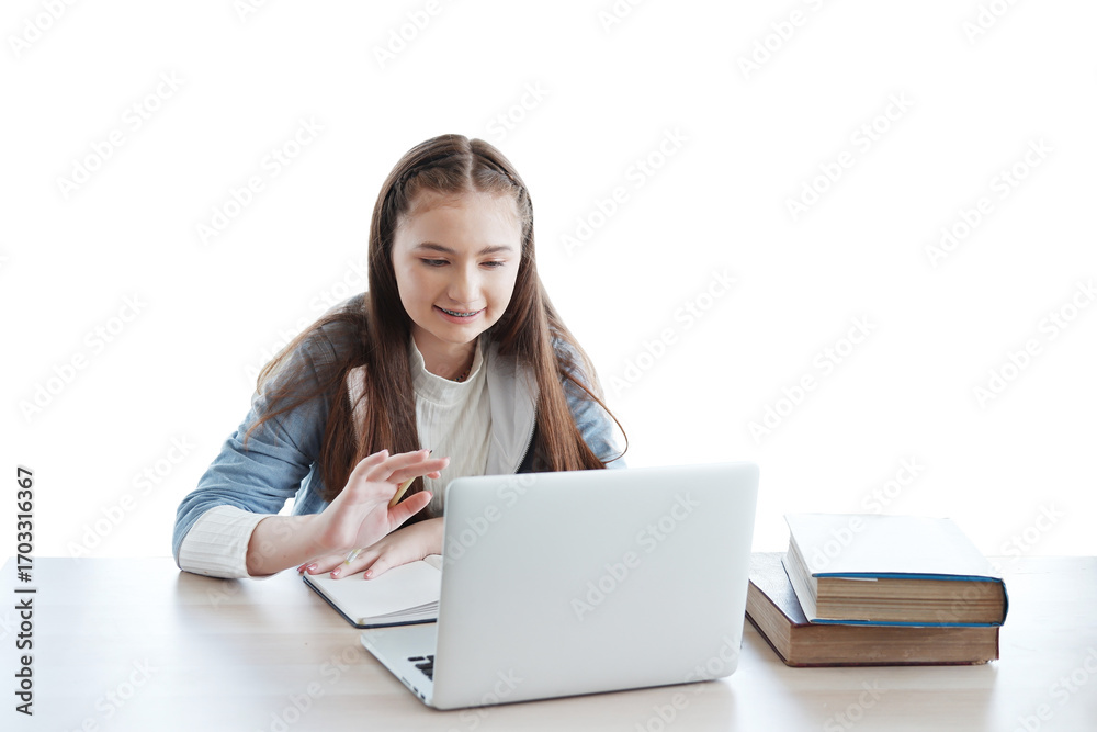Obraz premium Smiling Caucasian girl learning online with laptop and chatting with people in classroom of school. Education cancept
