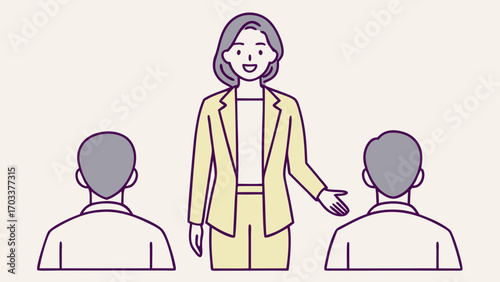 Woman executive in yellow suit addressing two people from behind purple