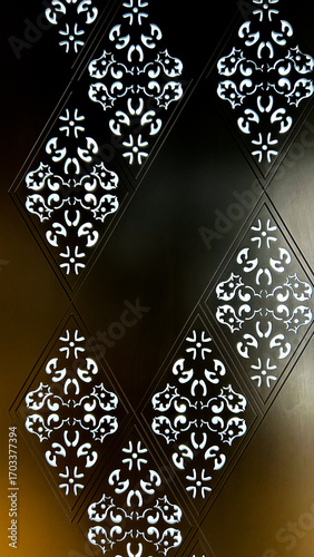 Obraz na plátně Ornamental Wall Panel With Backlit Cut-Out Patterns, Close-Up Of Decorative Geom