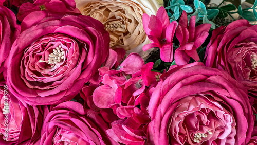 Fotografie Closeup Of Artificial Pink And Cream Roses With Green Leaves, Soft Fabric Petals