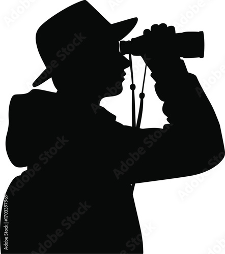 Silhouette person wearing hat looking through binoculars