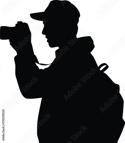 Silhouette of a person holding a camera photography