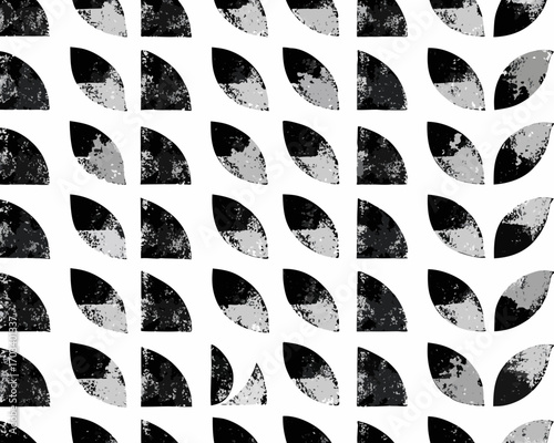 Abstract geometric pattern of textured quarter circles in black and white