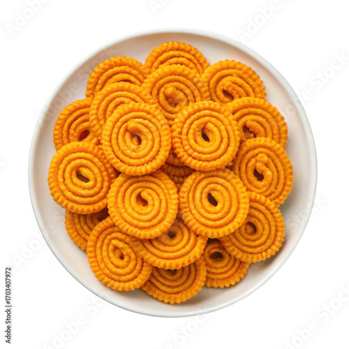 Delectable golden brown chakli snacks piled high on a white plate