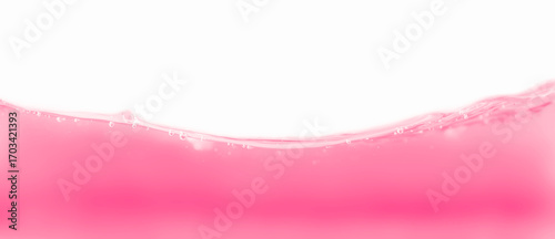 Abstract pink juice liquid splash, ripple surface against white background.	