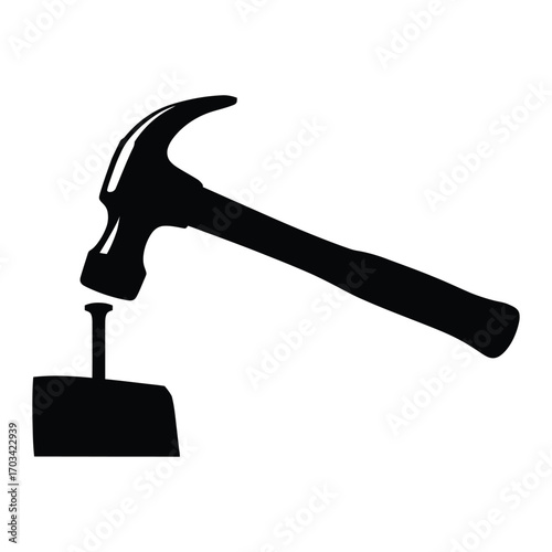 Silhouette of a hammer poised to strike a nail on a block of wood