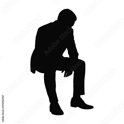Silhouette of a man wearing a hat and jacket sitting and looking down thoughtfully