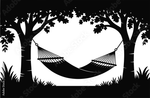 Hammock suspended between trees in silhouette nature