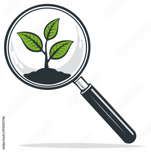 Magnifying glass focused on a fresh green plant sprout growing from rich dark soil
