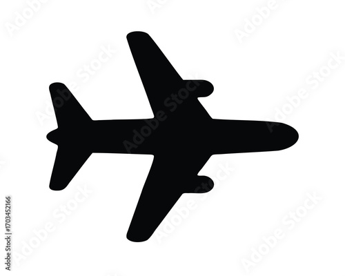 A simple black airplane flying in the sky on a clear day