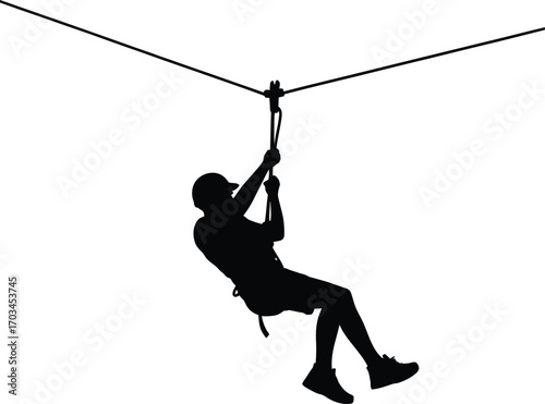 Person ziplining wearing helmet and shorts silhouette