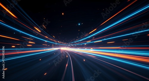 Dynamic neon light trails in blue and orange creating a sense of speed and motion on a dark road. Futuristic abstract background design concept for technology, energy, and fast movement.