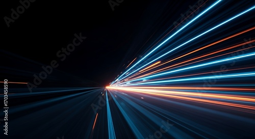 Dynamic neon light trails in blue and orange creating a sense of speed and motion on a dark road. Futuristic abstract background design concept for technology, energy, and fast movement.
