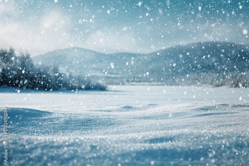 Serene winter landscape featuring snow-covered fields, softly rolling hills under a lightly clouded sky, with falling snowflakes adding a soft, dreamy feel