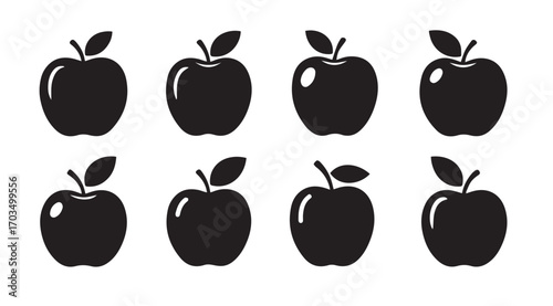 Collection of eight black apple silhouettes with stems and leaves