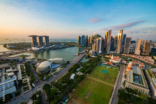 Photography Aerial view of Singapore Marina Bay with iconic skyscrapers, Marina Bay Sands, and the financial district, symbolizing global economy, ESG, inflation impact, and sustainable growth