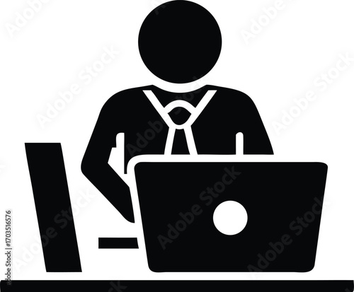 Man in suit working on laptop and monitor on a black desk