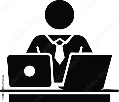 Business person with two laptops on a desk wearing a shirt and tie