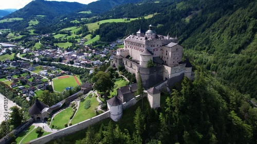 Austria tourism . greatest historic landmarks. impressive Hohenwerfen castle medieval fortress surrounded by Alps mountains. aerial 4k footage. Austrian market town of Werfen in the Salzach valley