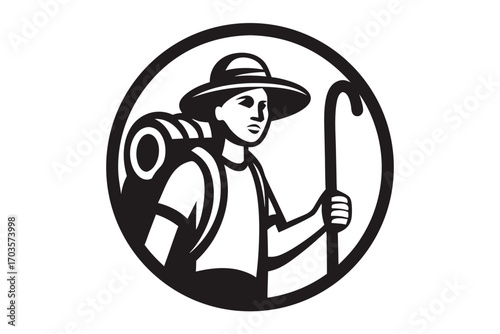 Black and white shows a woman hiker with a backpack near the mountain