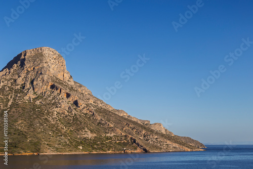 View of the rugged Telendos island in Greece on a sunny day. Copy space.
