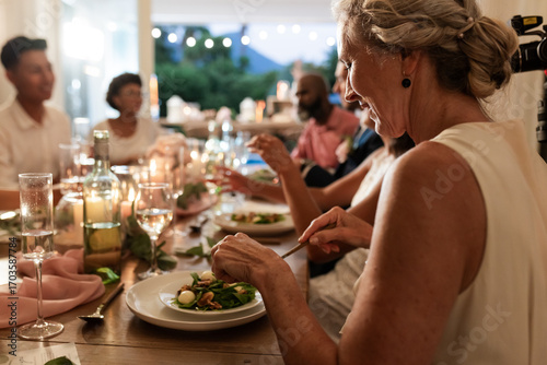 Εκτύπωση καμβά At wedding reception, guests sharing laughter and conversation during elegant di