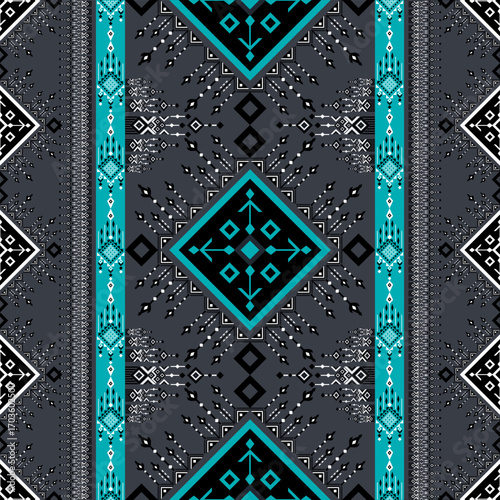 A seamless vector pattern inspired by traditional folk art and trpibal weaving. The design features geometric shapes and intricate details in a modern color palette of teal, black, and white. Perfect 