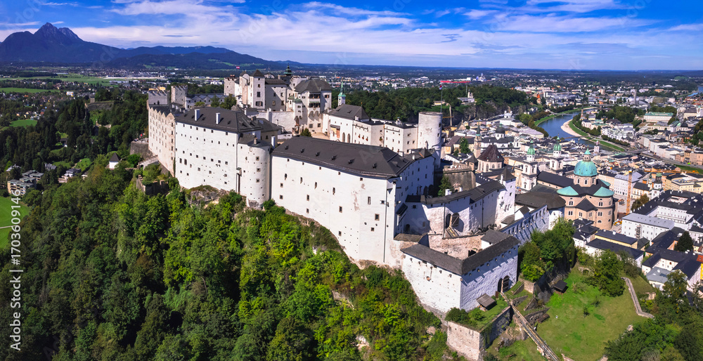 Obraz premium Austria travel and landmarks. majestic Hohensalzburg fortress aerial drone view of old town Salzburg and castle. Austrian tourism