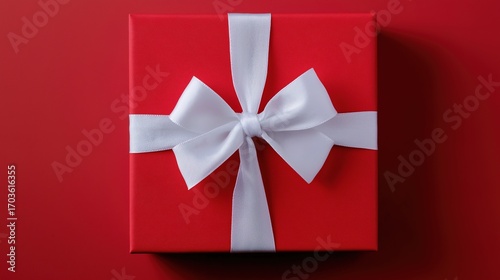 Red gift box with white ribbon and bow, centered product shot on clean background.