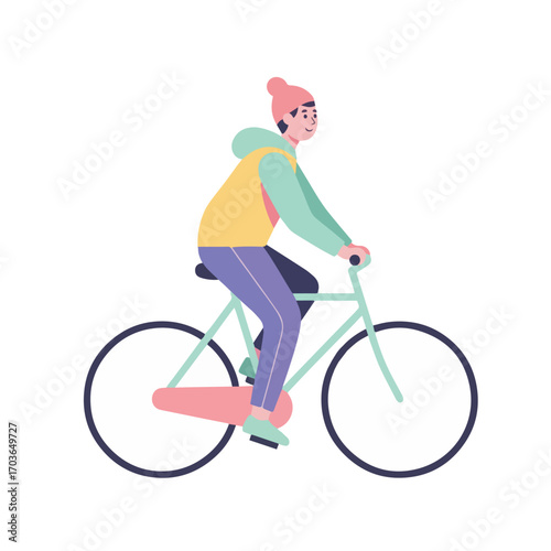A person rides a bicycle, wearing a beanie, hoodie, and pants. The bike is light blue.
