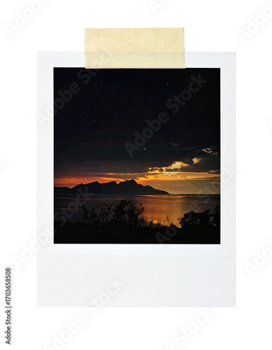 Vintage polaroid of a sunset over mountains