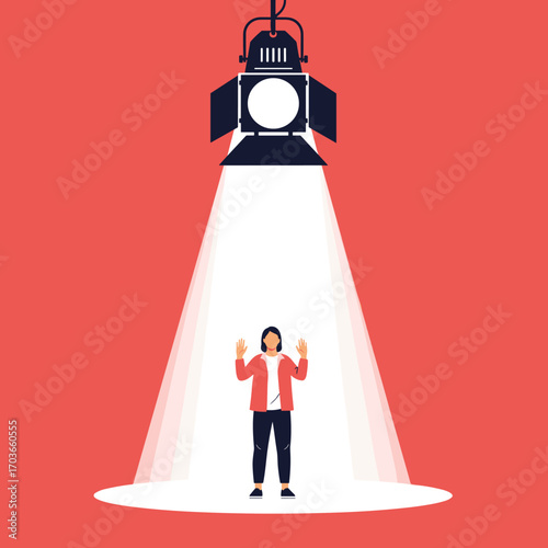 Person standing in spotlight on red background.