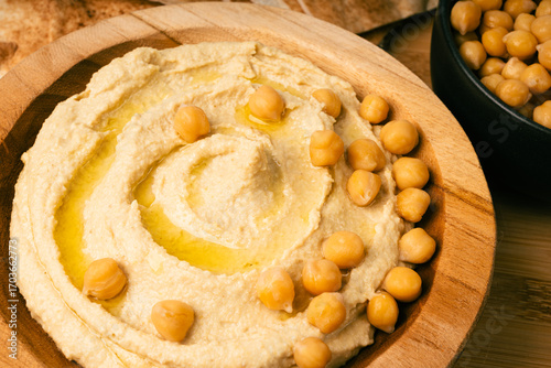 Hummus in bowl, houmous dip, chickpea humus tahini sauce, middle eastern spread