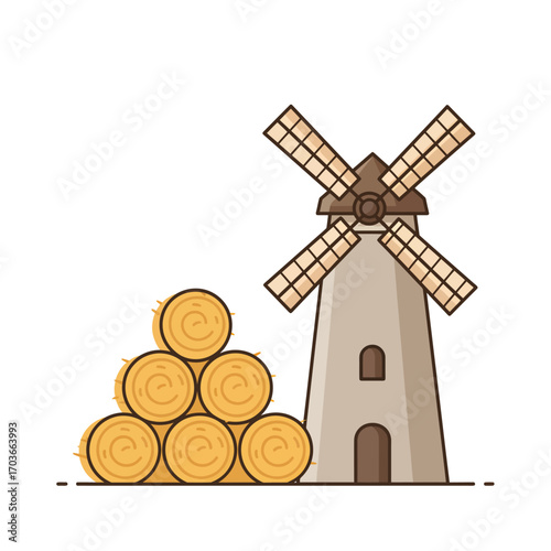 A classic European-style windmill stands next to a neatly stacked pile of round hay bales.