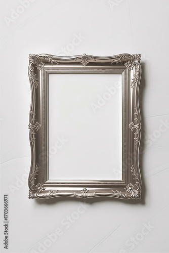 Empty silver ornate picture frame.
