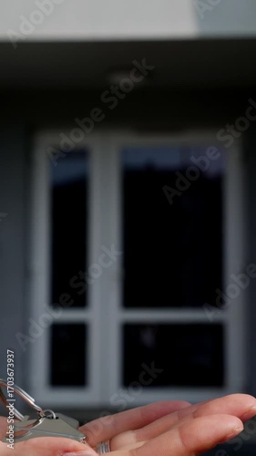 Woman receiving house keys from man – homeownership, rental agreement, property handover