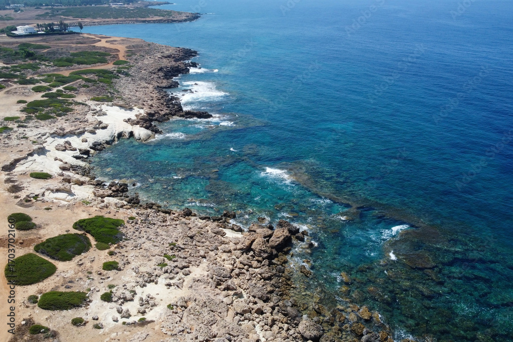 Fototapeta premium Aerial view of Mediterranean coastline near by The Edro III Shipwreck on sunny day. Peyia, Cyprus.