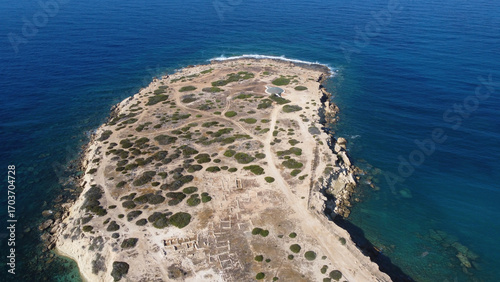 Aerial view of remains of Maa Palaeokastro (Late Bronze Age) settlement on sunny summer day. Peyia, Cyprus.