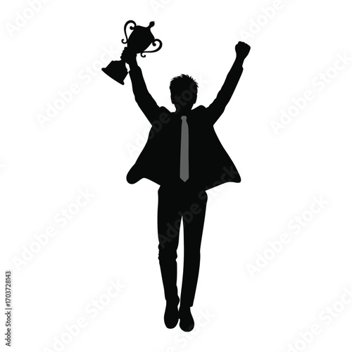 Silhouette of a triumphant businessman raising a trophy in celebration of success